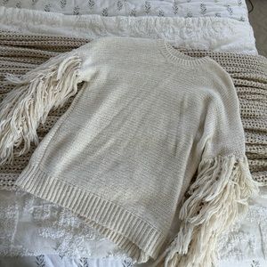 Cream sweater with fringe sleeves